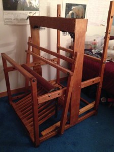 The breast beam, treadles, rear beam and beater are attached.